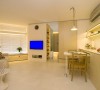 公寓以白色和米色为主色调，暖色调的灯光营造出温馨的氛围。设计师以极简的风格和明快的线条，使得空间最大化，兼顾了美观和实用的特点。