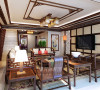客厅区域：地面用樱桃桃木色的地板，墙面与顶面采用了中式木格与壁纸，能够凸显出传统的文化底蕴。