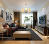 简洁的电视墙造型与现代感十足的家具组合共同营造一个温馨大气的感觉