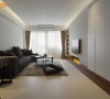 柜体与电视主墙面的整合，加大面宽之际也让沙发家私能有更舒适的尺度安排。