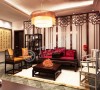 客厅是主人品位的象征，沙发背景墙采用红木雕花背景墙，既美观大方又极具装饰性。