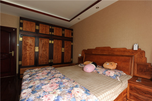 中式风格 卧室图片来自成都金煌装饰在繁华的都市里，一个宁静祥和的家的分享