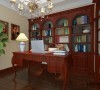 书房是一整排的红胡桃实木书柜，古色古香的书香味。