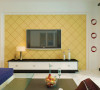 客厅电视背景墙，内部做成菱形的石膏板拉缝，刷上黄漆，两边做上简单的造型，简单时尚，体现出整个客厅空间的主题。