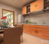 厨房为定制橱柜，温暖的橘色橱柜，与旁边的暗咖色餐椅形成呼应，使得厨房操作区与用餐区形成和谐的整体，而餐桌上的配饰为厨房增添了时尚感。