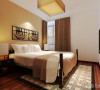 小卧室的床头背景墙是有一个中式的造型，实木木线条包边，内镶嵌软包，整体中式家具。