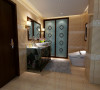 卫生间选择石材效果的墙面砖配合青花瓷的洗手盆与实木印花浴室柜，既实用又不失美感。