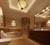 在主卧卫浴的设计中，采用了圆形的造型手法塑造淋浴空间，空间圆润，和扇形浴缸形成弧形元素的搭配，使整体空间对称的造型有个对比，形成独特的个性浴室空间。