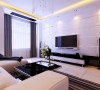 客厅采用回字形吊顶加暗藏灯带增加客厅空间造型感，白色电视背景墙与黑白色电视柜形成强烈对比，是对现代感表现的淋漓尽致的表现。