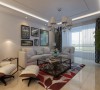 沙发背景墙，设计师以简约纯白设计，搭配几幅装饰画，塑造放松舒适的休闲、交流空间。
