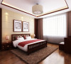 在卧室的实际上考虑整体效果的统一性，在床头背景以实木墙饰与软包的结合，及体现中式风格效果及利用软包提升整体空间的舒适度。