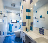 延续著地中风情，两个小女儿共用的卫浴空间，以蓝、白砖色作为异国表情的意象传达。