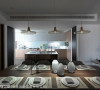 开放的厨房场域，以中岛吧台为中心，引导出空间流畅感及简洁利落的视觉影像。