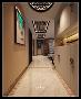 保利拉菲公馆走廊装修效果图，定制入户柜，吊顶花格，挂画都是亮点。