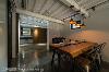 二楼作为会议场所，延续DECK板及水泥粉光等视觉基底，搭配自然边的实木桌，营造如咖啡厅般的人文氛围。