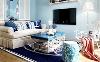 【融科天域-客厅】客厅的背景墙以蓝色为主，小麦换三个的地板，深蓝色的地毯，武汉整装装修空间很有格调。