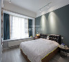 卧室则采用了深蓝绿色的墙面漆，搭配同色系的窗帘，使空间干净简约。