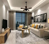 客厅沿用玄关柜的设计风格，电视柜和茶几在设计构思上都追求造型简约，风格突出。室内颜色选择也和谐自然，白色、米白、灰白、暖黄、原木色等同色系组成了一个简约又温馨的空间。