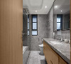 灰色花纹墙砖，玻璃门作为干湿分离，镜柜的加入，整个环境清爽又干净。加长洗漱柜，满足日常的收纳。