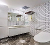 主人卫生间以小块白砖+六边形灰白地砖搭配，结合简约精致的洗手盆搭配，呈现出一个现代年轻的气息；