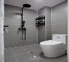 烟灰色的瓷砖，亮度适中，简洁清爽。高低两用的淋浴，也适用于家人。一旁的同色系双层置物架，方便摆放洗浴用品。