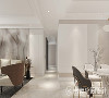 客餐厅空间采用同色系设计，墙面背景图案不同又隐隐呼应，简素却不直白，含蓄着肌理的变化，在细节处精致。