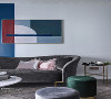 沙发背景墙用简约的曲线元素与丰富的色彩过渡打造设计的时尚风情。蓝色墙漆与主卧的背景色一致，以过道为延伸，循序渐进，整体感强。