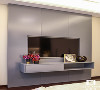 电视墙则选用大面积整体灰色，与整个设计色调呼应。